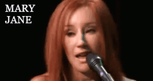 Woman Singing Into Microphone Mary Jane Behind GIF