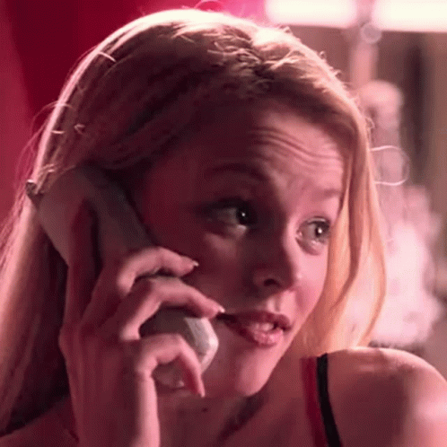 A Close Up Of A Woman Talking On A Cell Phone . GIF