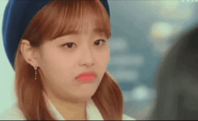 A Close Up Of A Woman Wearing A Beret And Making A Funny Face GIF