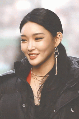 A Close Up Of A Woman Wearing A Black Jacket GIF