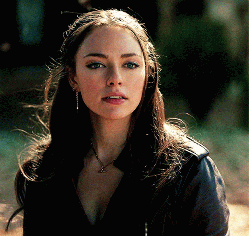 A Close Up Of A Woman Wearing A Black Jacket GIF
