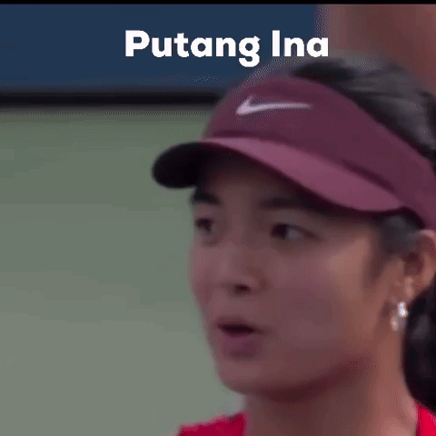 A Close Up Of A Woman Wearing A Hat With The Word Puting Ina On It . GIF