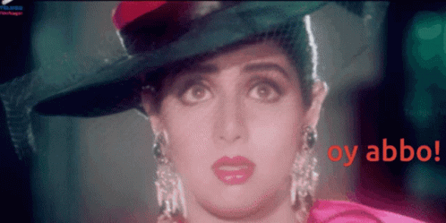 A Close Up Of A Woman Wearing A Hat With The Words Oy Abbo In Red GIF