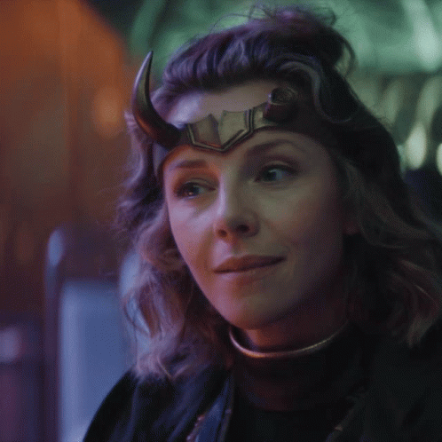 A Close Up Of A Woman Wearing A Horned Helmet GIF