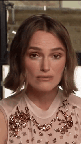 A Close Up Of A Woman Wearing A White Dress GIF
