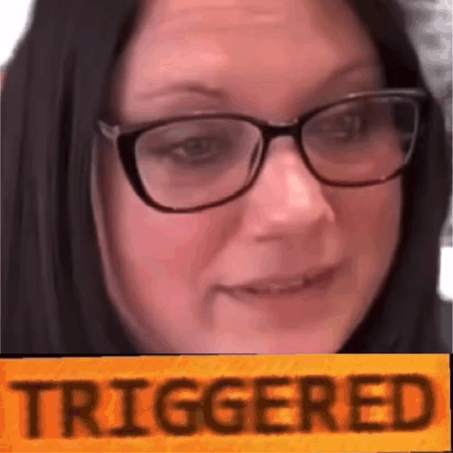A Close Up Of A Woman Wearing Glasses And A Yellow Sign That Says Triggered . GIF
