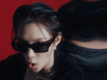 A Close Up Of A Woman Wearing Sunglasses GIF