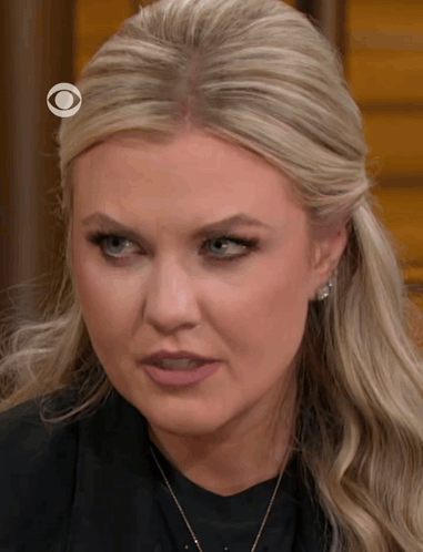 A Close Up Of A Woman With A Cbs Logo On Her Head GIF