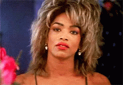 A Close Up Of A Woman With A Wig On GIF