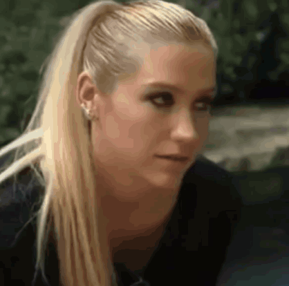 A Close Up Of A Woman With Blonde Hair In A Ponytail GIF
