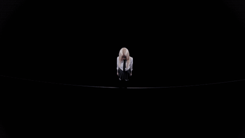 A Close Up Of A Woman With Blonde Hair Looking Down GIF