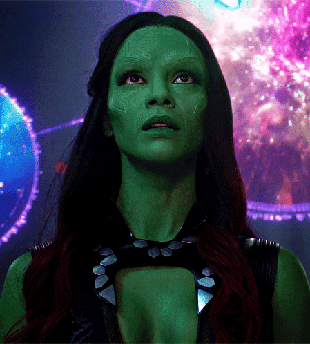 A Close Up Of A Woman With Green Face GIF