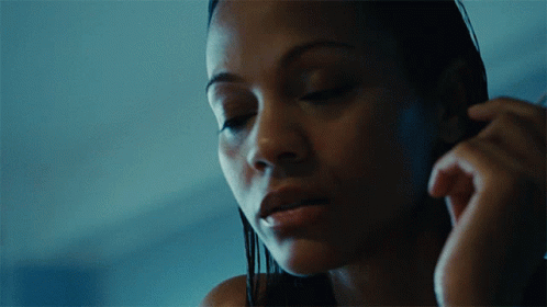 A Close Up Of A Woman With Her Eyes Closed GIF