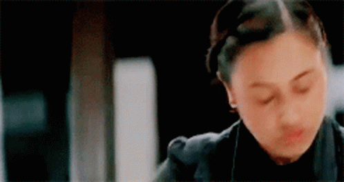 A Close Up Of A Woman With Her Eyes Closed . GIF