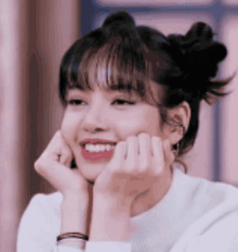 A Close Up Of A Woman With Her Hands On Her Face . GIF