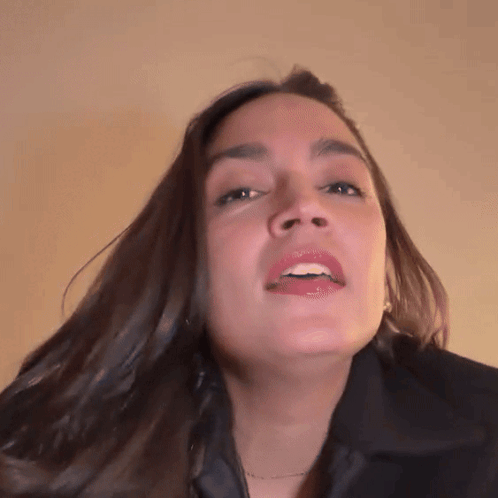A Close Up Of A Woman With Her Mouth Open GIF