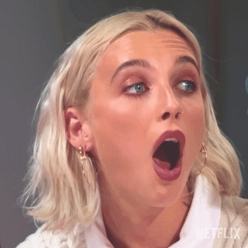 A Close Up Of A Woman With Her Mouth Open . GIF