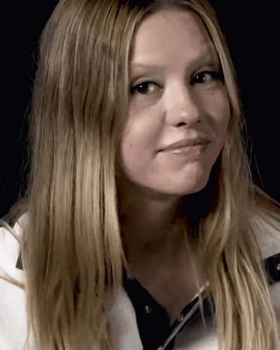 A Close Up Of A Woman With Long Blonde Hair GIF