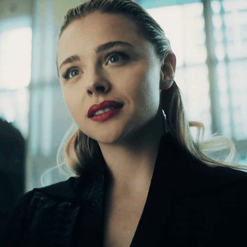 A Close Up Of A Woman With Red Lips GIF