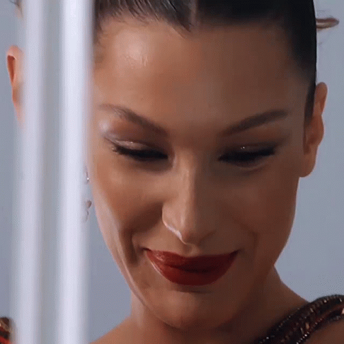 A Close Up Of A Woman With Red Lipstick On Her Lips GIF