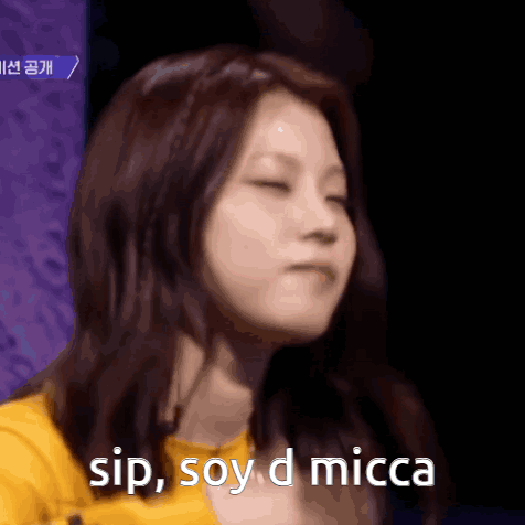 A Close Up Of A Woman With The Words Sip Soy D Micca Above Her GIF