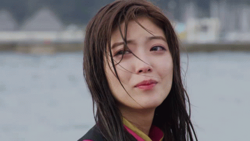 A Close Up Of A Woman With Wet Hair GIF