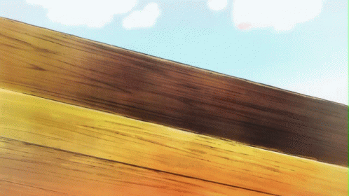 A Close Up Of A Wooden Fence With A Blue Sky In The Background GIF