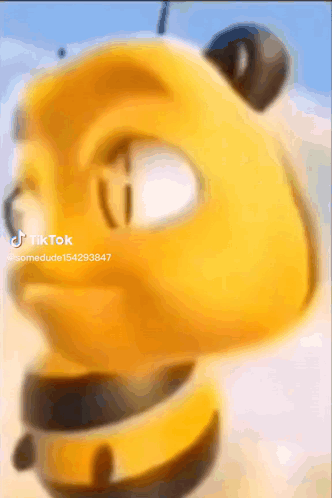 A Close Up Of A Yellow Cartoon Character 'S Face With A Blurred Background . GIF