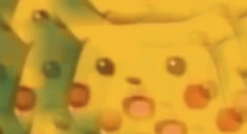 A Close Up Of A Yellow Cartoon Character 'S Face With A Surprised Look On Its Face . GIF