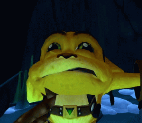 A Close Up Of A Yellow Cartoon Character With A Green Triangle On His Chest GIF