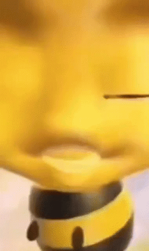 A Close Up Of A Yellow Toy That Looks Like A Bee Spinning On A Spinning Top . GIF
