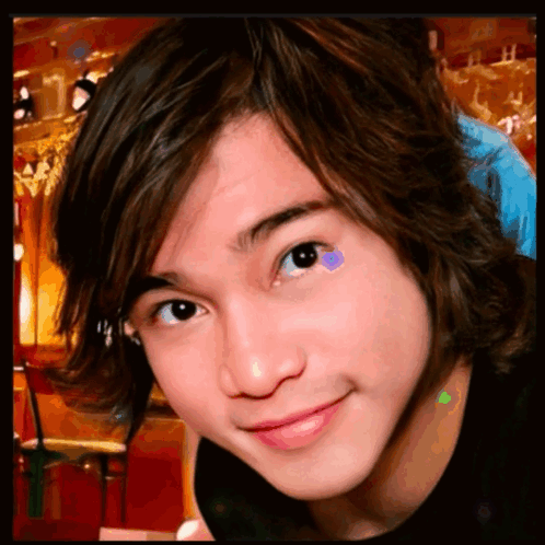 A Close Up Of A Young Boy 'S Face With A Purple Heart On His Eye GIF