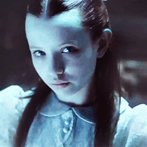 A Close Up Of A Young Girl With Long Hair GIF