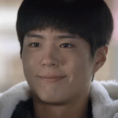 A Close Up Of A Young Man 'S Face Smiling GIF