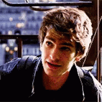A Close Up Of A Young Man 'S Face With A Backpack . GIF