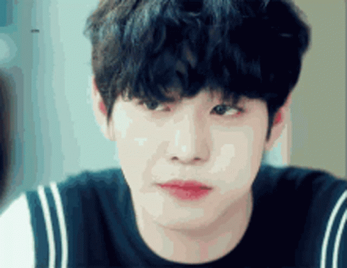A Close Up Of A Young Man 'S Face With A Black Shirt On GIF