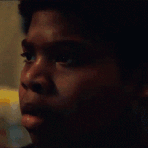 A Close Up Of A Young Man 'S Face With A Blurred Background GIF