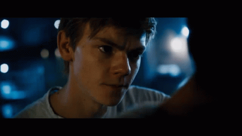A Close Up Of A Young Man 'S Face With A Blurry Background GIF