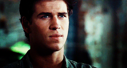 A Close Up Of A Young Man 'S Face With A Serious Look On His Face GIF