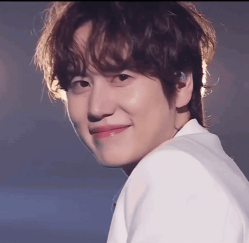 A Close Up Of A Young Man 'S Face With A Smile On His Face GIF