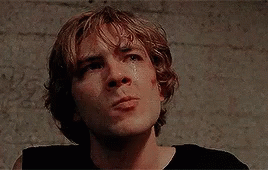 A Close Up Of A Young Man 'S Face With A Tear Running Down His Cheek . GIF