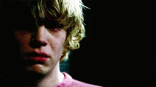 A Close Up Of A Young Man 'S Face With A Tear Running Down His Cheek . GIF