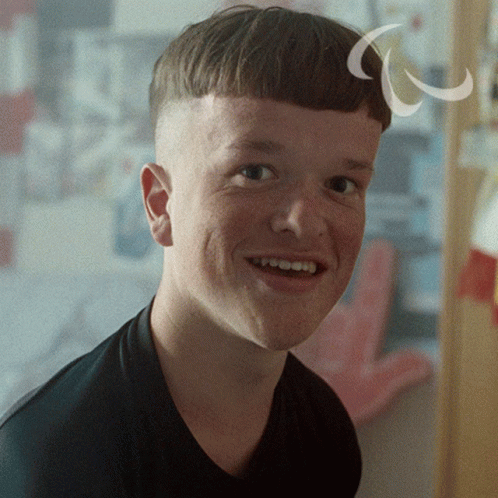 A Close Up Of A Young Man 'S Face With A White Circle Around His Head GIF