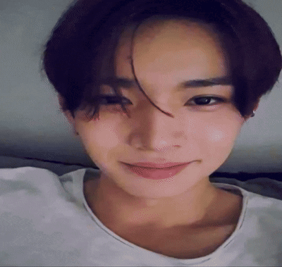 A Close Up Of A Young Man 'S Face With A White Shirt On GIF