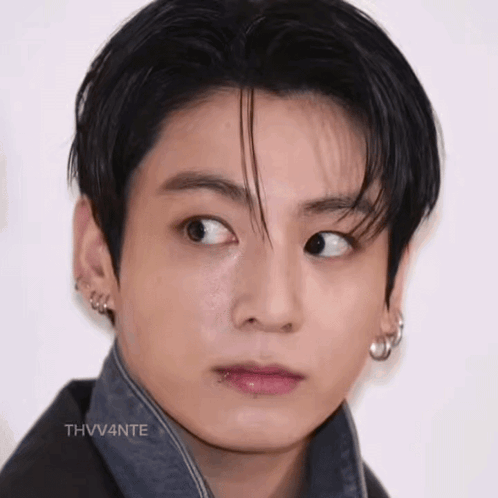 A Close Up Of A Young Man 'S Face With His Eyes Closed And His Mouth Open . GIF