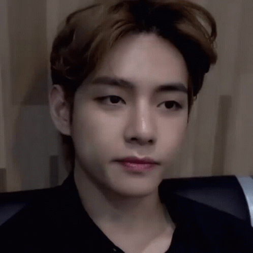 A Close Up Of A Young Man 'S Face With His Eyes Closed And His Mouth Open . GIF