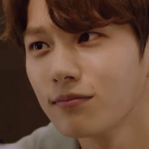 A Close Up Of A Young Man 'S Face With His Eyes Closed And His Mouth Open . GIF