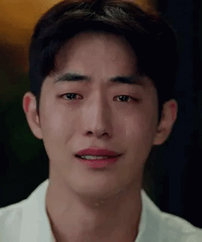 A Close Up Of A Young Man 'S Face With Tears Running Down His Face . GIF