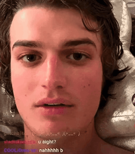A Close Up Of A Young Man 'S Face With The Words " U Aight " On The Bottom Right GIF