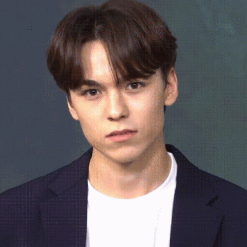 A Close Up Of A Young Man Wearing A Blue Jacket And White Shirt GIF